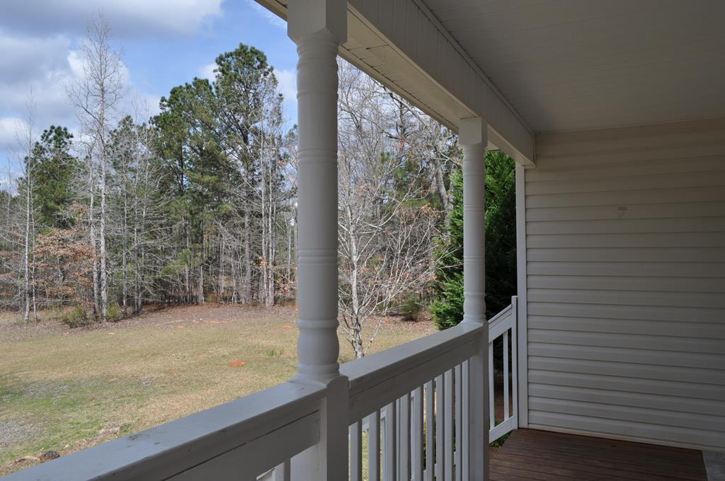 142 Old Indian Springs Road Forsyth, GA 31029 - Photo 23 of 30 a view of a porch with a yard