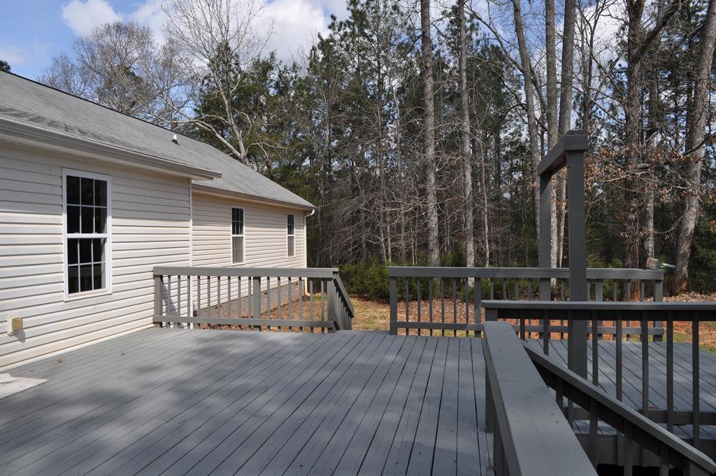 142 Old Indian Springs Road Forsyth, GA 31029 - Photo 26 of 30 a view of a house with a wooden deck