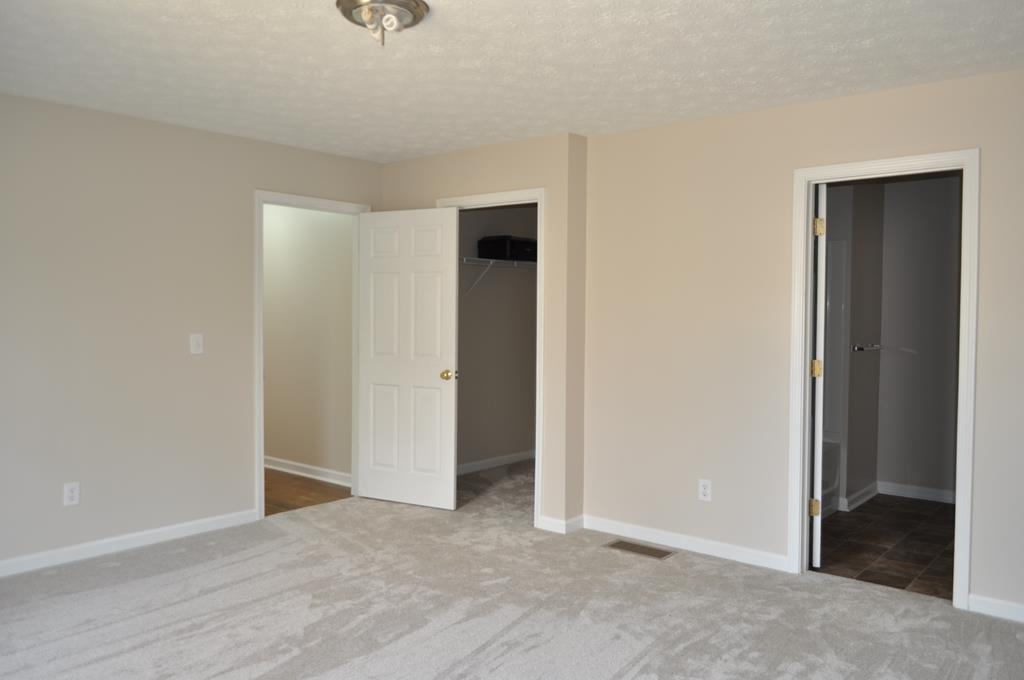142 Old Indian Springs Road Forsyth, GA 31029 - Photo 9 of 30 an empty room with closet and wooden floor