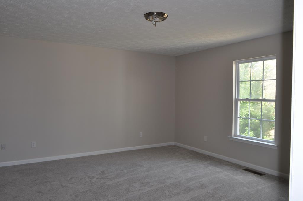 142 Old Indian Springs Road Forsyth, GA 31029 - Photo 10 of 30 an empty room with a window