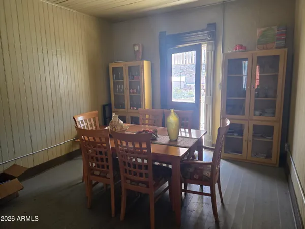 a living room with furniture and a view of kitchen