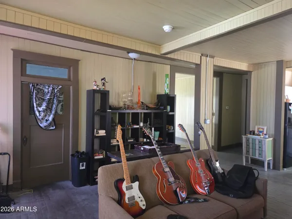 a view of a hallway view with wooden floor and windows