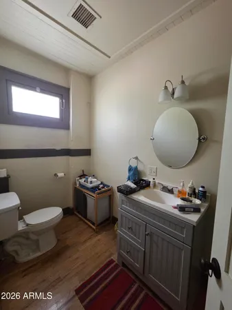 a bedroom with furniture and a window