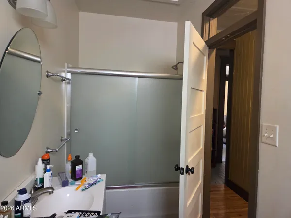 a view of a balcony with furniture and a potted plant