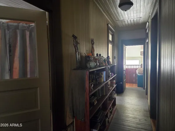 a bedroom with a bed and a tv