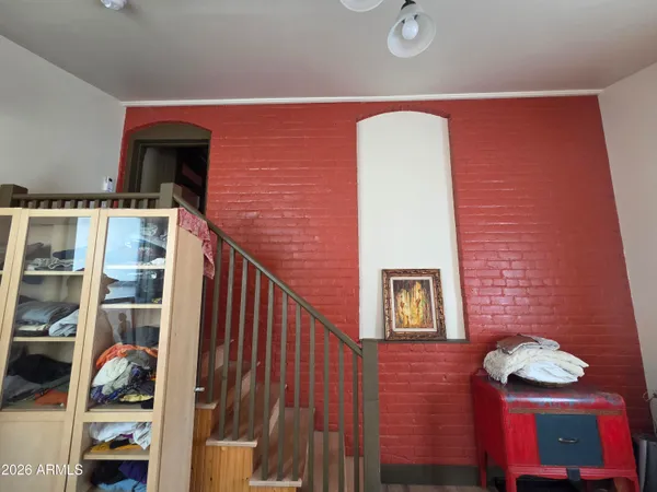 a kitchen with granite countertop a stove and a wooden floors