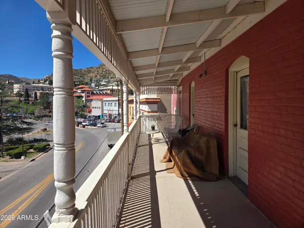 a bathroom with a sink a toilet a mirror and shower