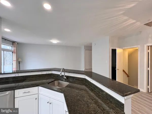 a kitchen with a sink and a window
