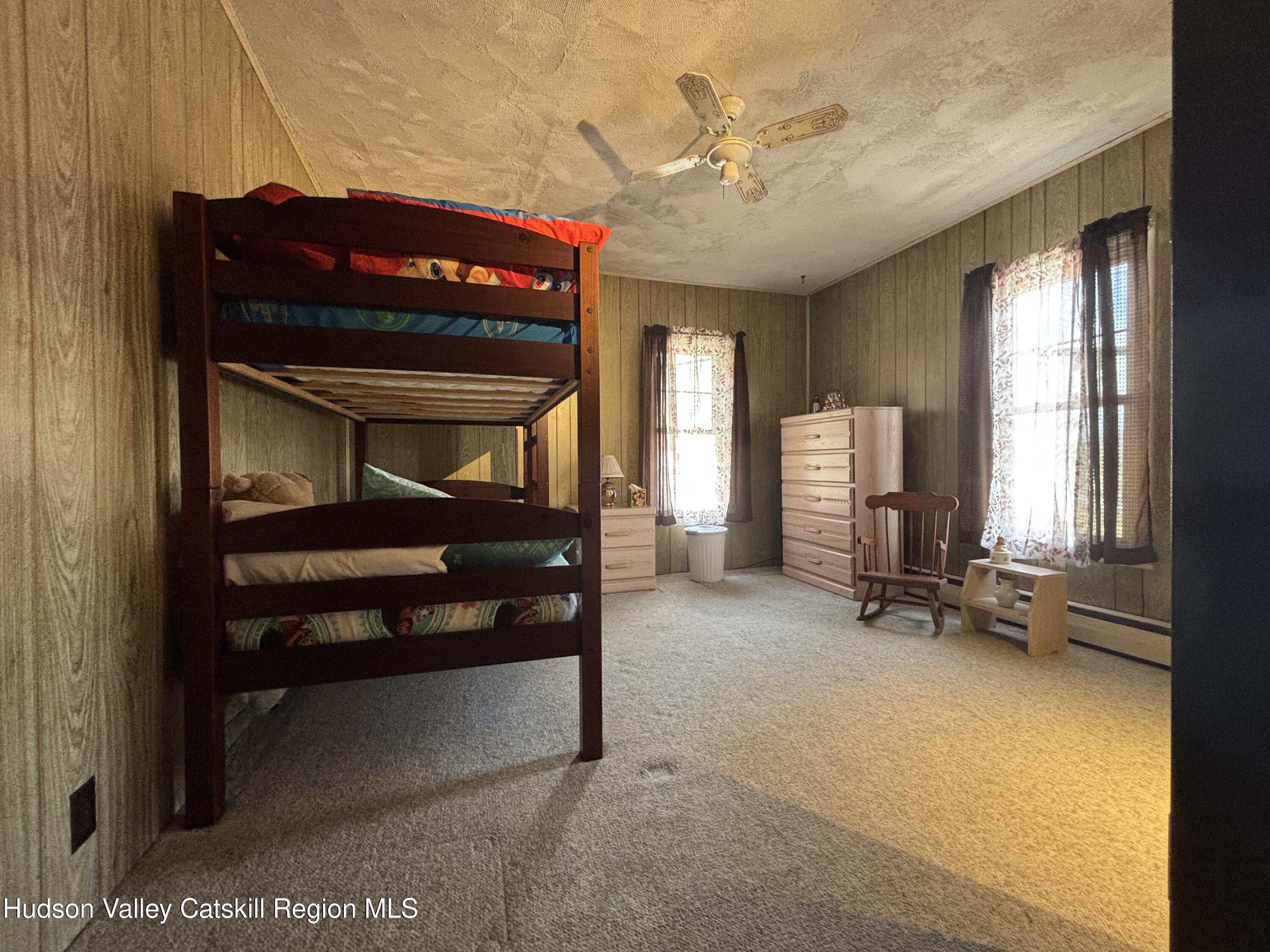 6 Maple Street Catskill, NY 12414 - Photo 12 of 20 a bedroom with furniture and a window