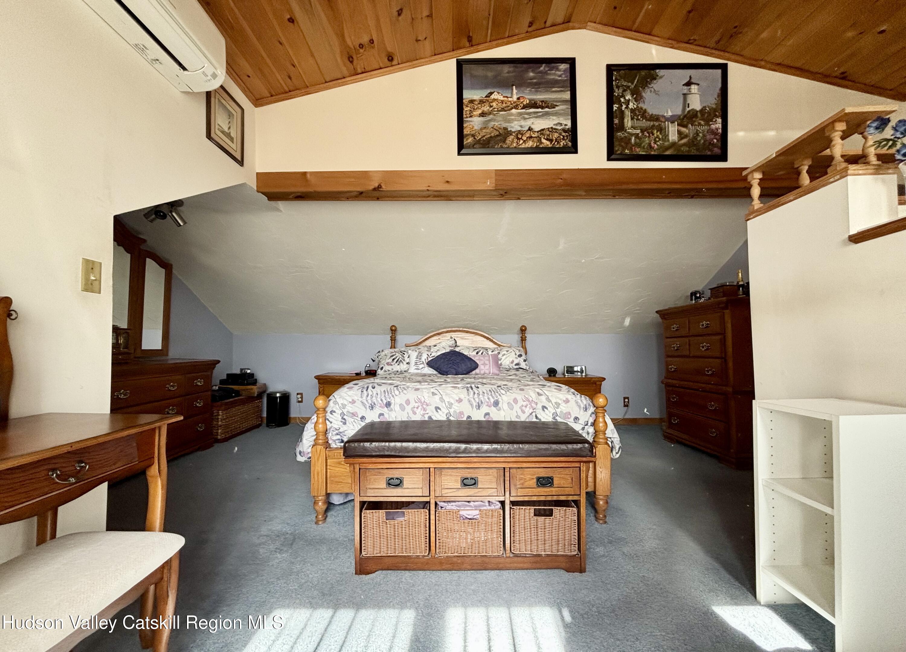 6 Maple Street Catskill, NY 12414 - Photo 18 of 20 a bed room with a bed and a potted plant