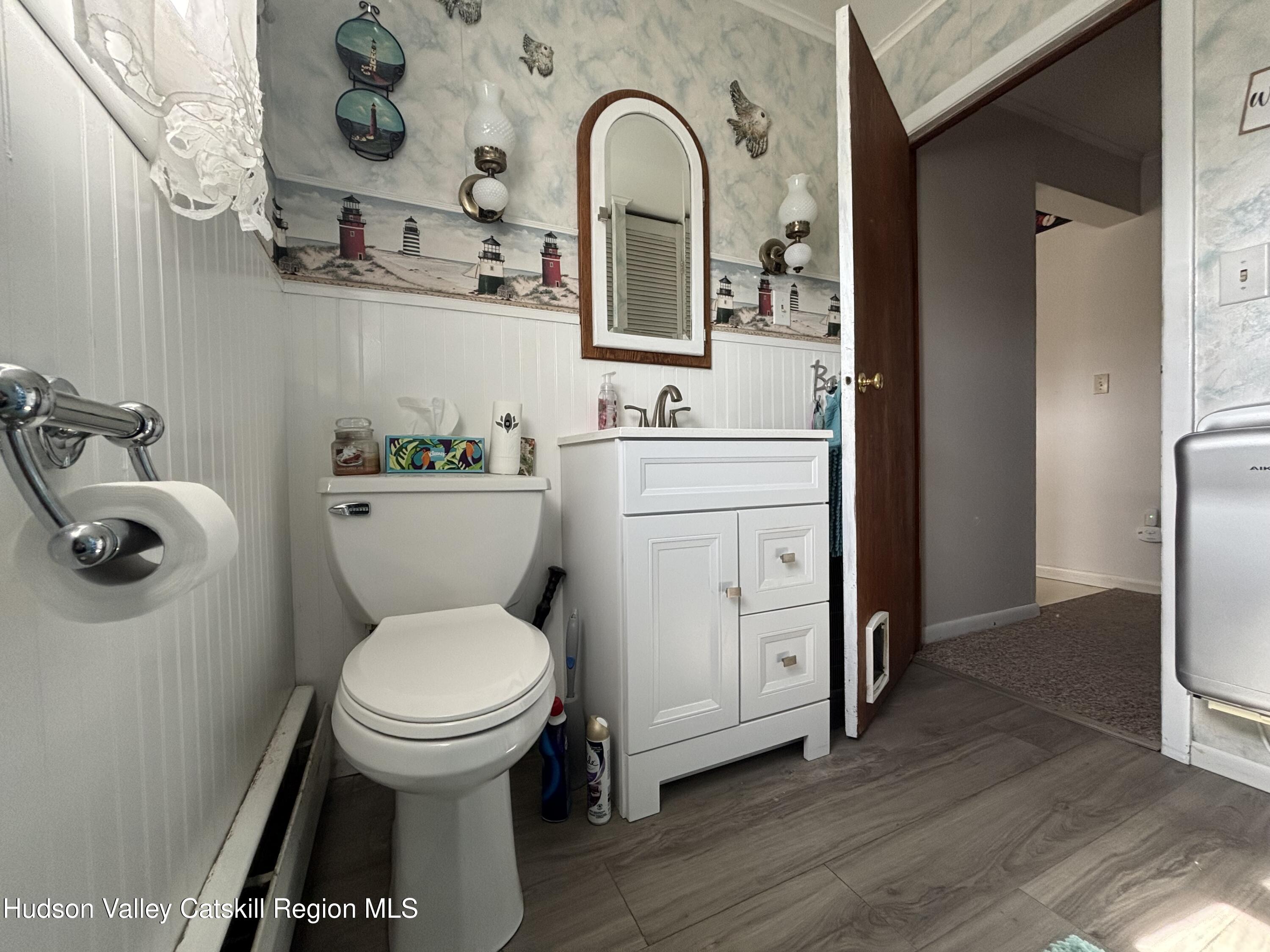 6 Maple Street Catskill, NY 12414 - Photo 10 of 20 a bathroom with a toilet sink and mirror