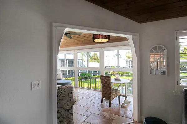 a view of a room with open porch and chairs