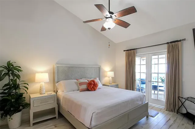 a bedroom with a large bed and a window