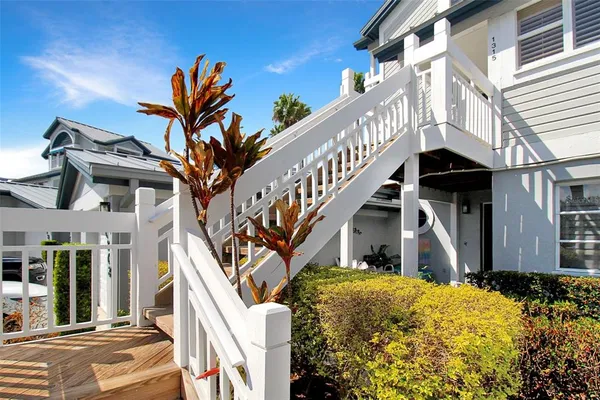 a view of a house with wooden stairs