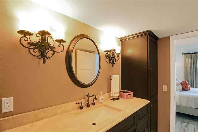 a bathroom with a sink and a mirror