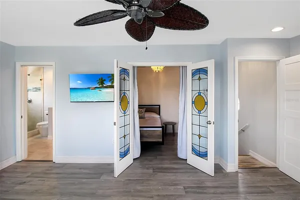 a view of an entryway and wooden floor