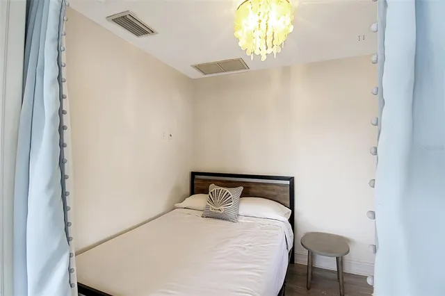 a bedroom with a bed and a table