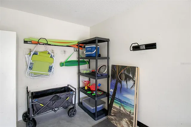 a view of washer and dryer with bathroom in the background