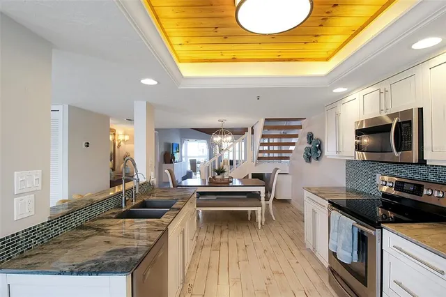 a kitchen with counter top space appliances and cabinets