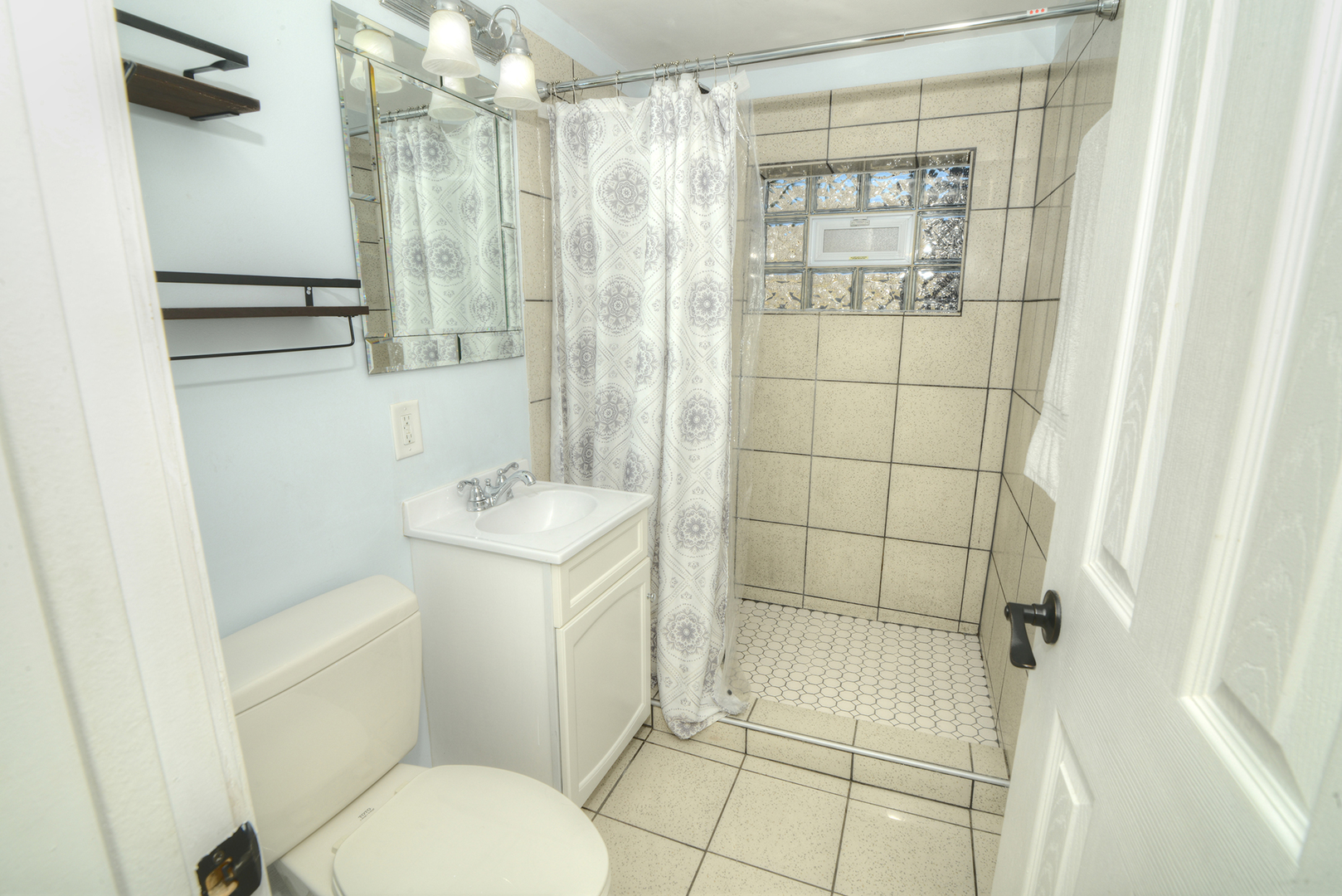 305 Maple Street Glen Ellyn, IL 60137 - Photo 15 of 28 a bathroom with a sink toilet and shower