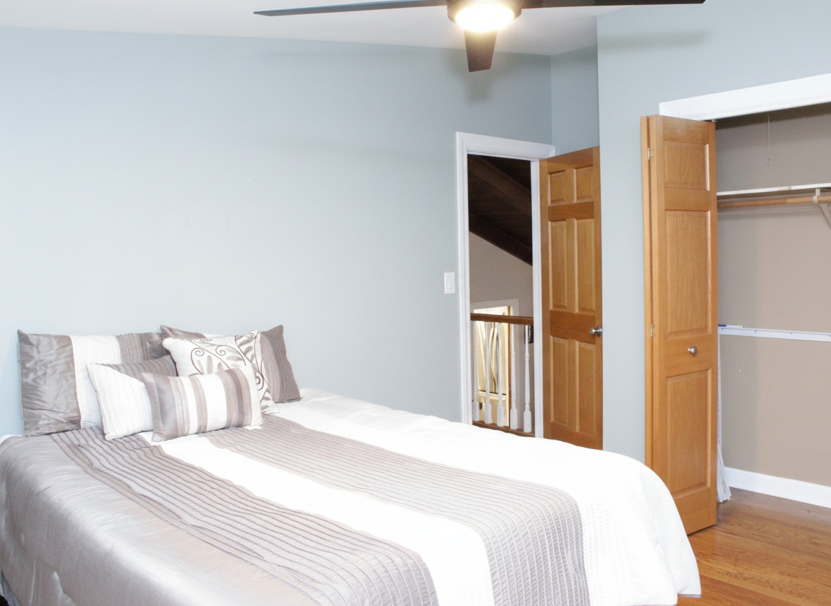 305 Maple Street Glen Ellyn, IL 60137 - Photo 16 of 28 a bedroom with a bed and a chandelier