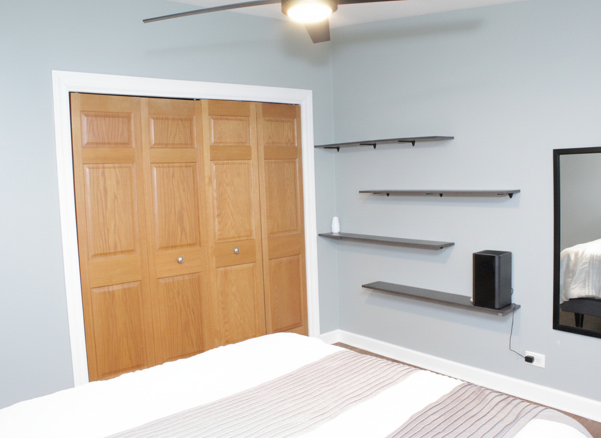 305 Maple Street Glen Ellyn, IL 60137 - Photo 17 of 28 a bedroom with a bed and a lamp on the dresser