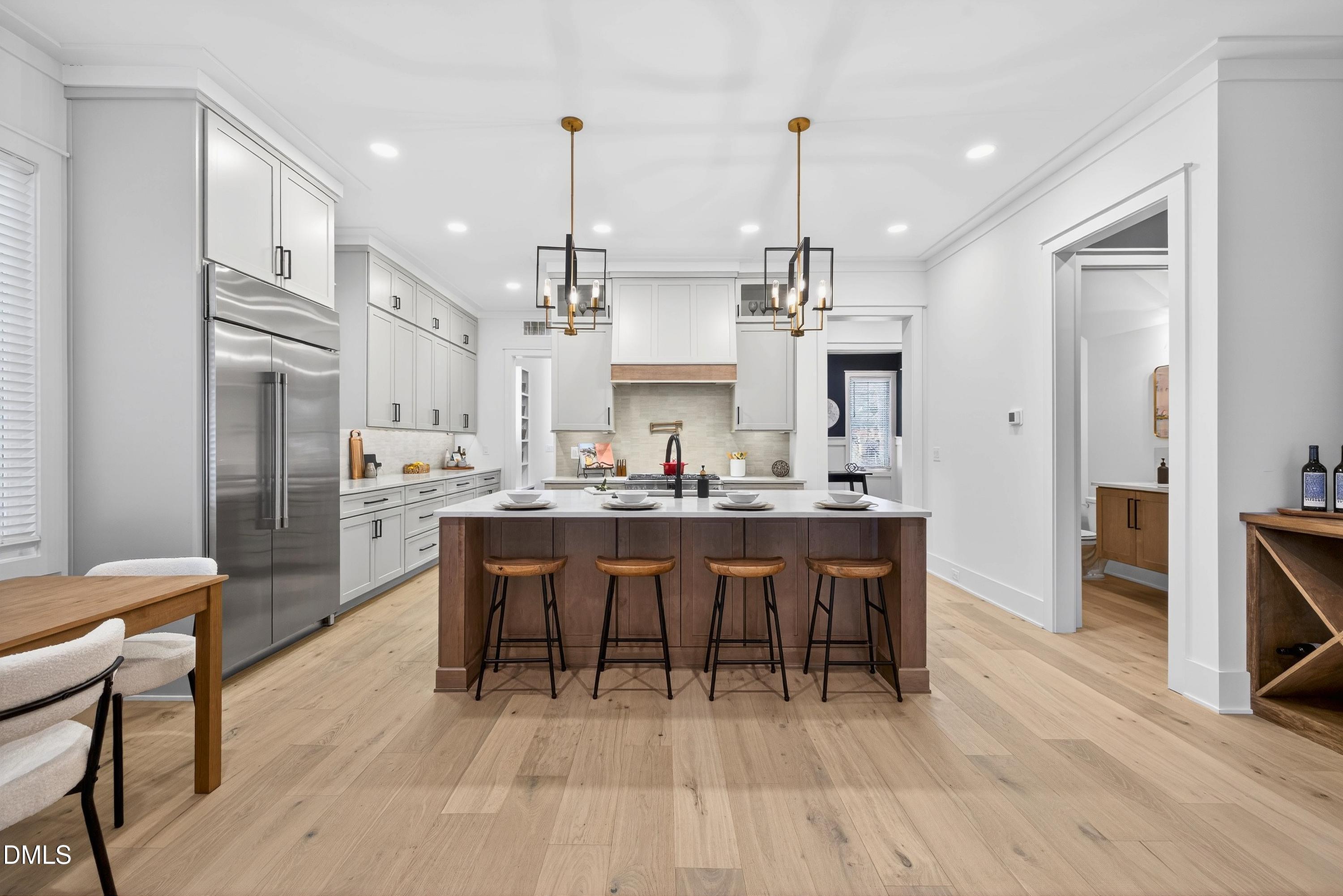 113 Boyd Street Cary, NC 27513 - Photo 16 of 88 a large kitchen with a table and chairs