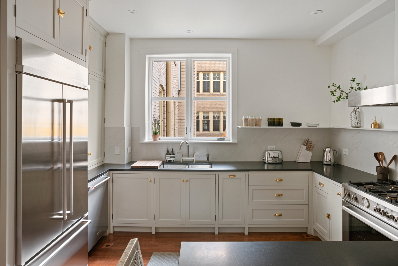 322 West Belden Avenue, Unit 1W Chicago, IL 60614 - Photo 13 of 24 a kitchen with a sink stove and refrigerator