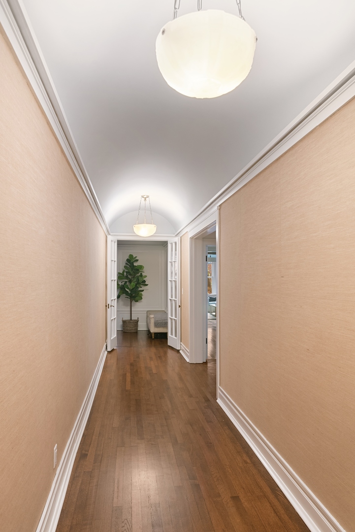 322 West Belden Avenue, Unit 1W Chicago, IL 60614 - Photo 15 of 24 a view of a room with wooden floor a potted plant