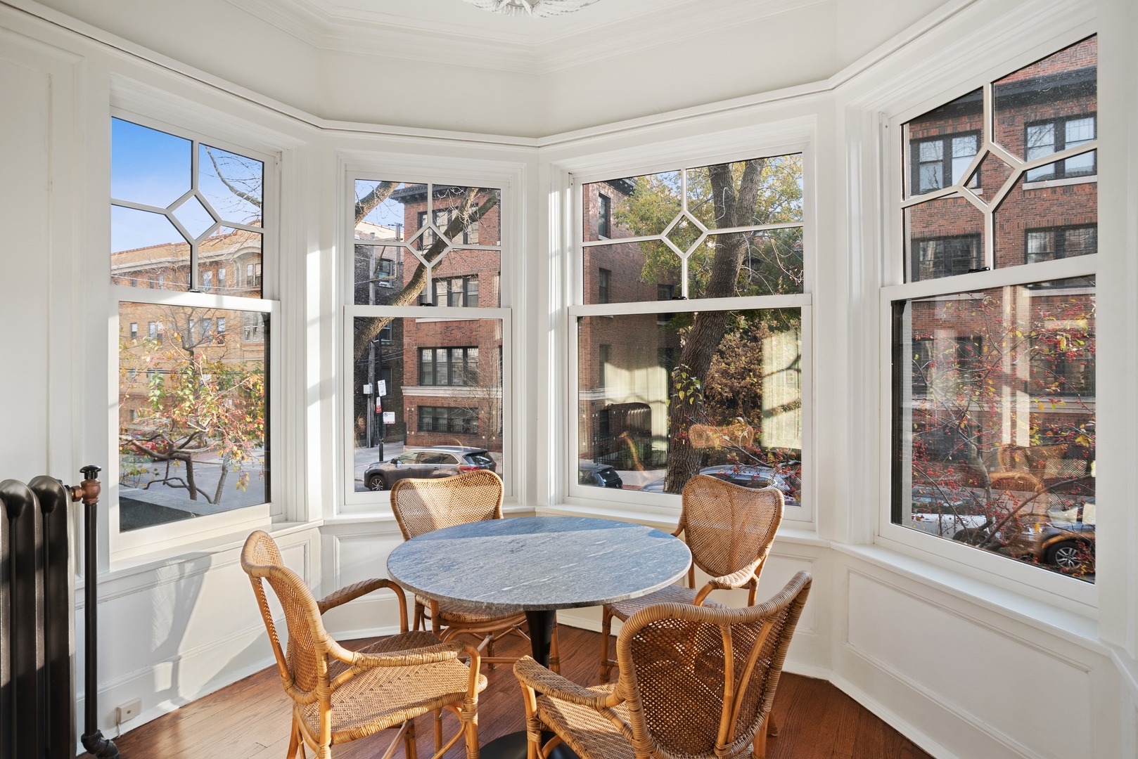 322 West Belden Avenue, Unit 1W Chicago, IL 60614 - Photo 9 of 24 a dining room with furniture a floor to ceiling window and wooden floor