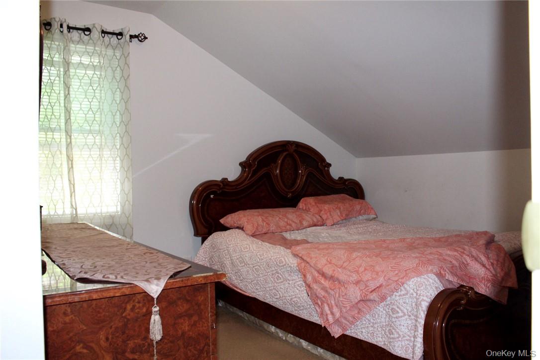 5834 Albany Post Road Cortlandt Manor, NY 10567 - Photo 9 of 14 Bedroom with lofted ceiling