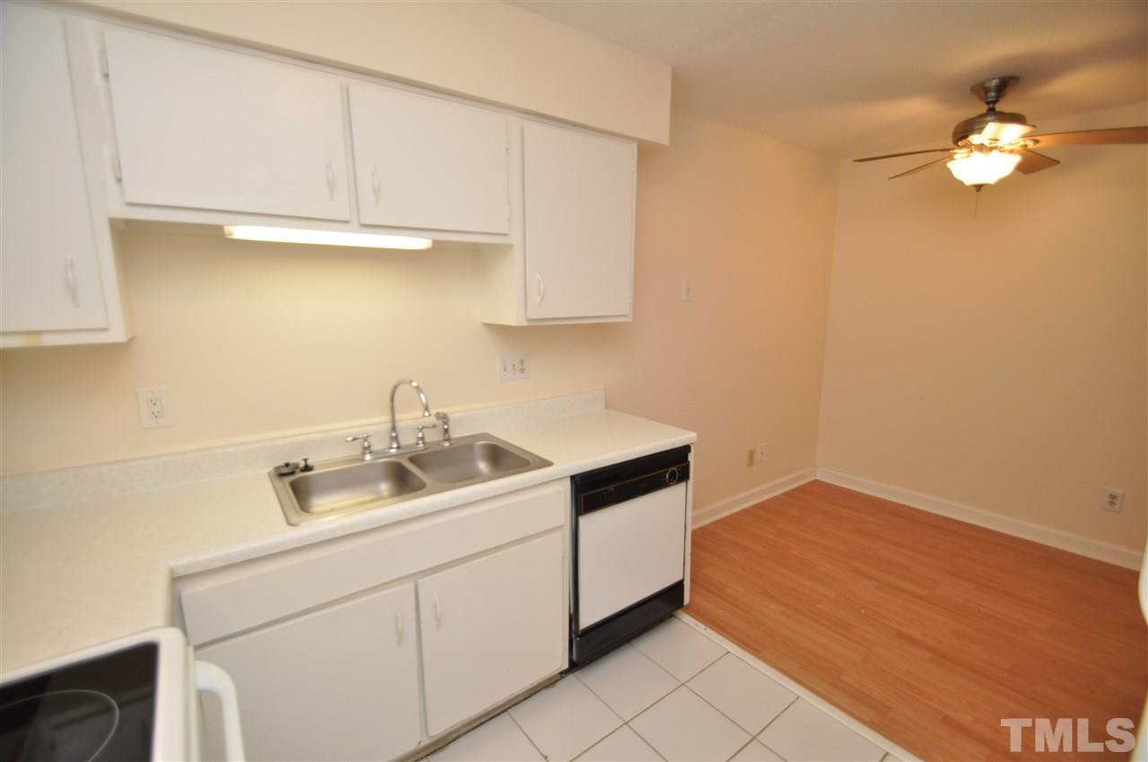 4341 Lake Ridge Drive Raleigh, NC 27604 - Photo 10 of 16 a kitchen with a sink cabinets and appliances