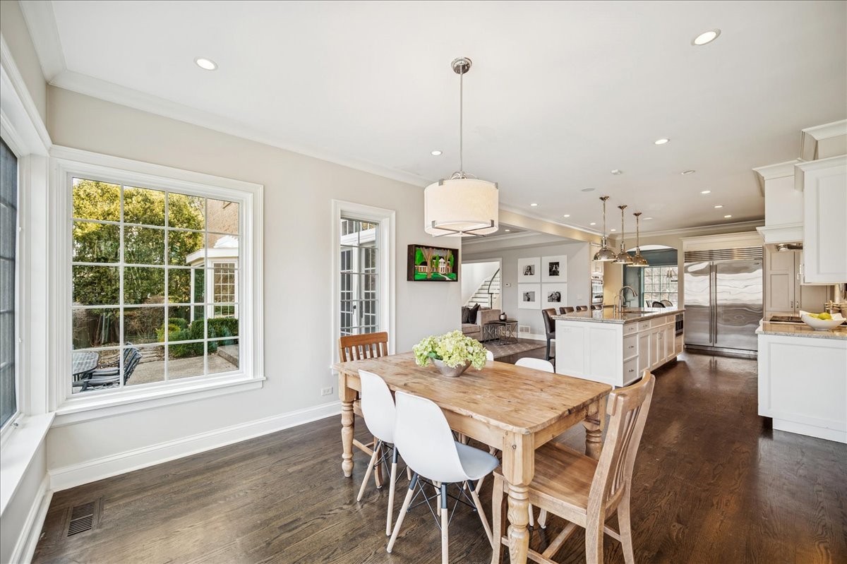 Undisclosed Address Winnetka, IL 60093 - Photo 16 of 55 a view of a dining room with furniture window and wooden floor