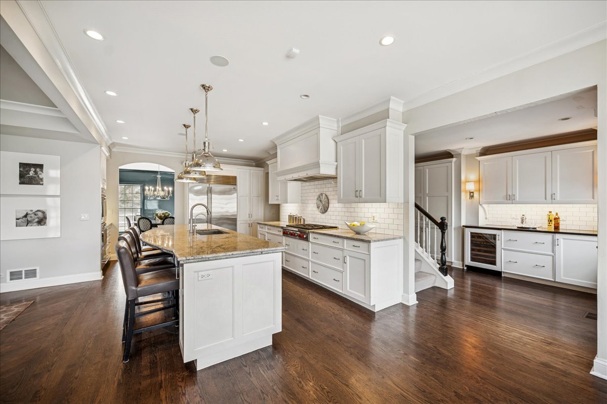 Undisclosed Address Winnetka, IL 60093 - Photo 17 of 55 a large kitchen with cabinets wooden floor and stainless steel appliances