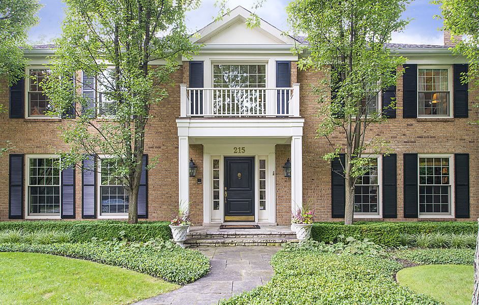 Undisclosed Address Winnetka, IL 60093 - Photo 2 of 55 front view of a house with a yard