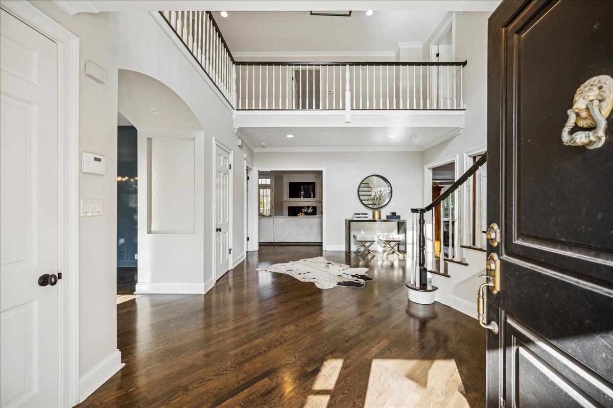 Undisclosed Address Winnetka, IL 60093 - Photo 3 of 55 a view of an entryway with wooden floor