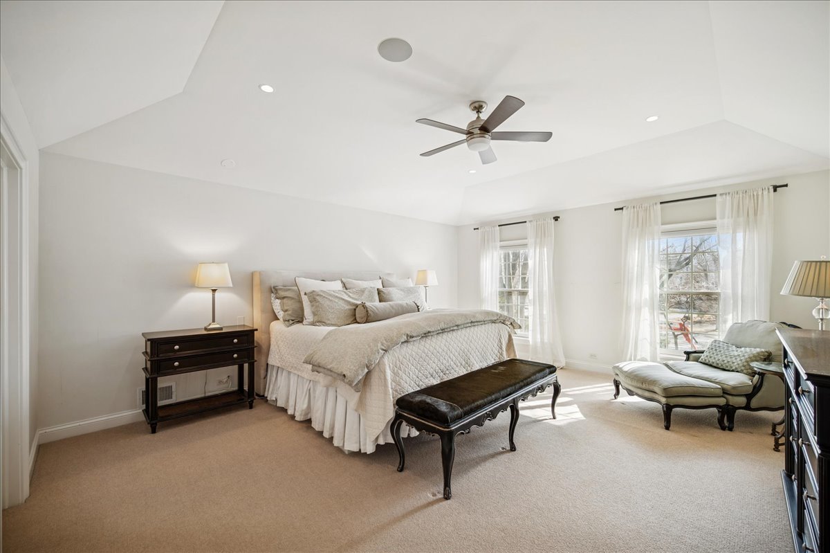 Undisclosed Address Winnetka, IL 60093 - Photo 31 of 55 a spacious bedroom with a bed and a window