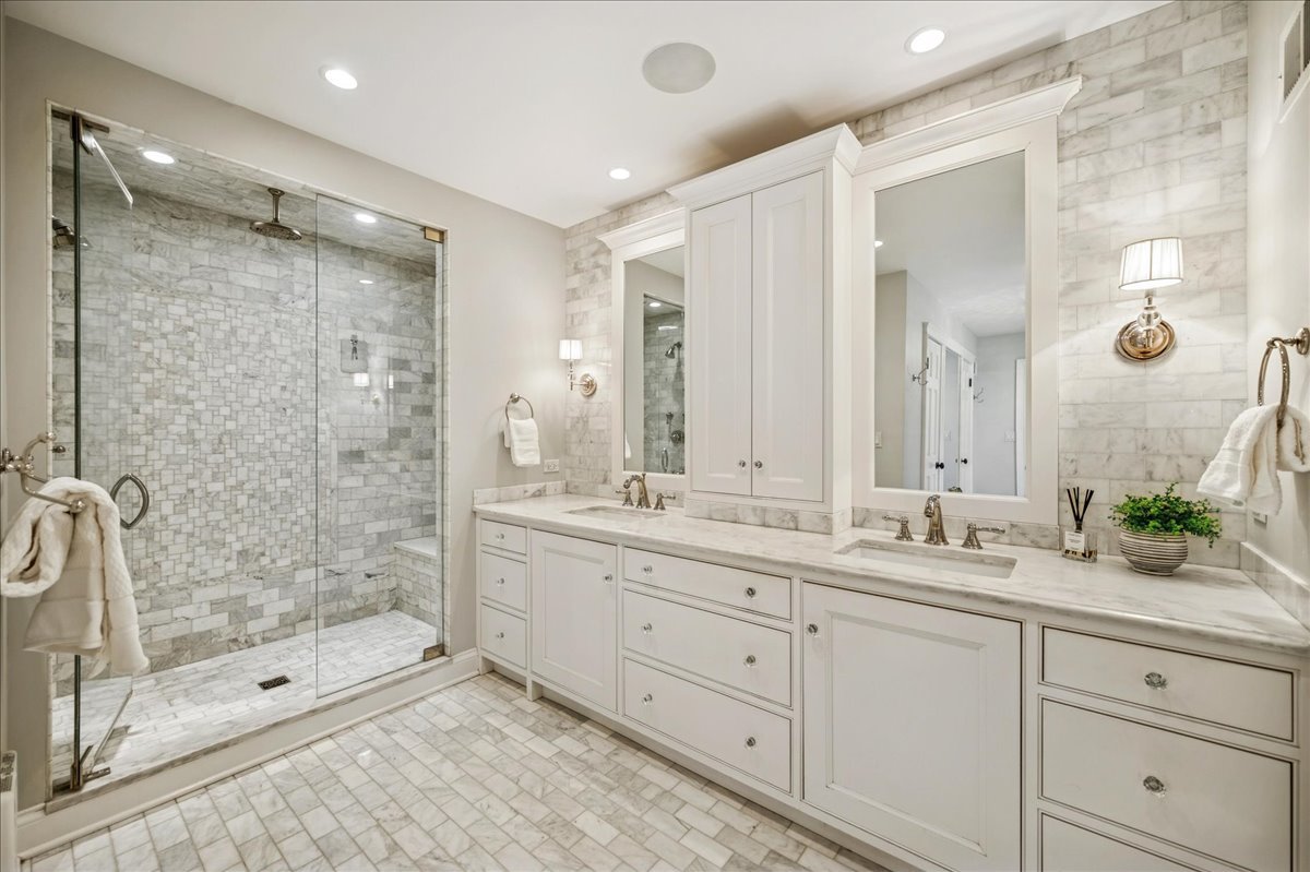Undisclosed Address Winnetka, IL 60093 - Photo 33 of 55 a bathroom with a double vanity sink mirror and shower
