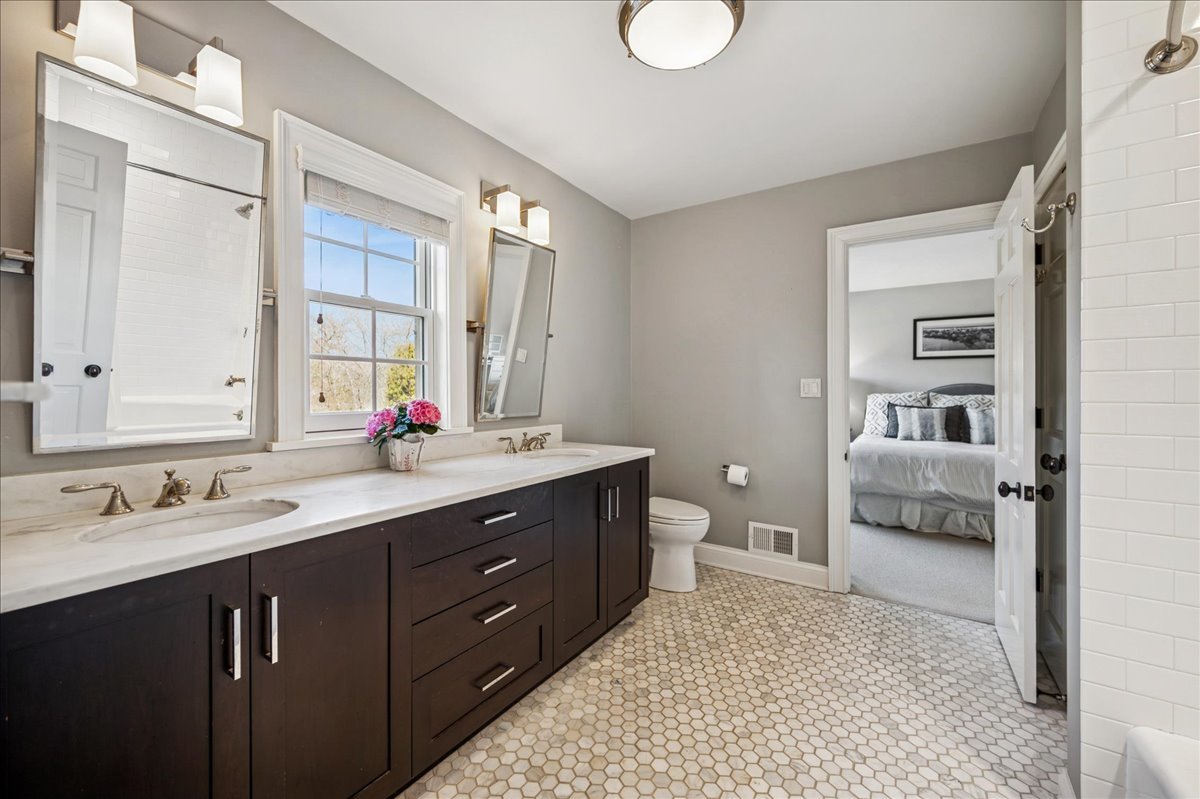 Undisclosed Address Winnetka, IL 60093 - Photo 36 of 55 a spacious bathroom with a sink double vanity and a mirror