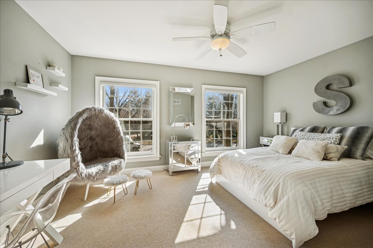 Undisclosed Address Winnetka, IL 60093 - Photo 37 of 55 a bedroom with a bed and wooden floor