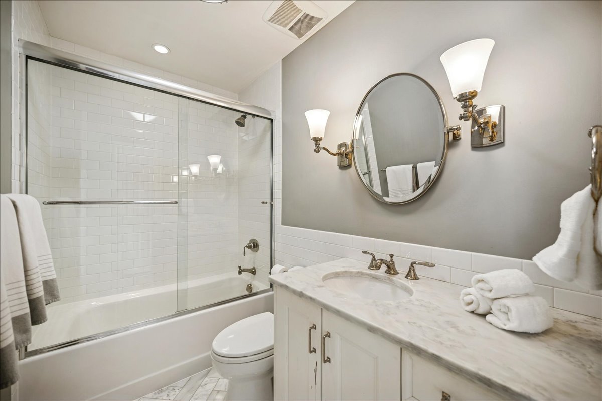 Undisclosed Address Winnetka, IL 60093 - Photo 38 of 55 a bathroom with a granite countertop sink mirror toilet and bathtub