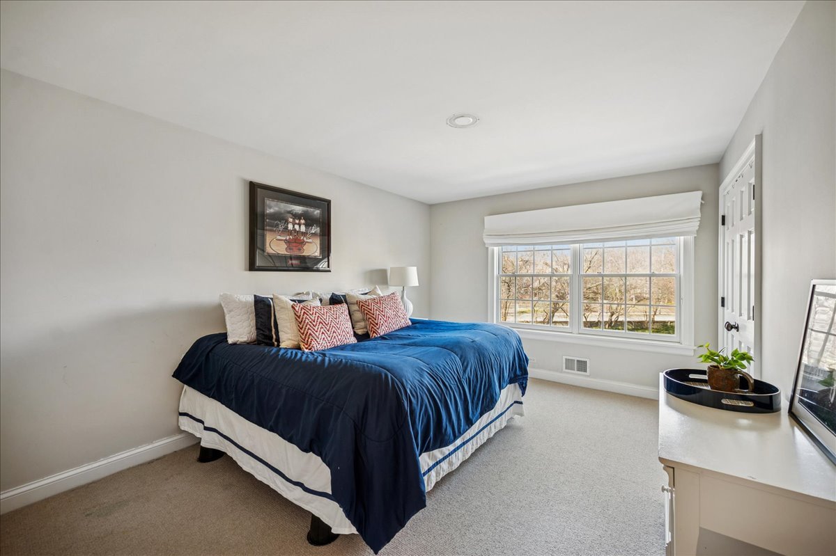 Undisclosed Address Winnetka, IL 60093 - Photo 39 of 55 a living room with a bed furniture and a window