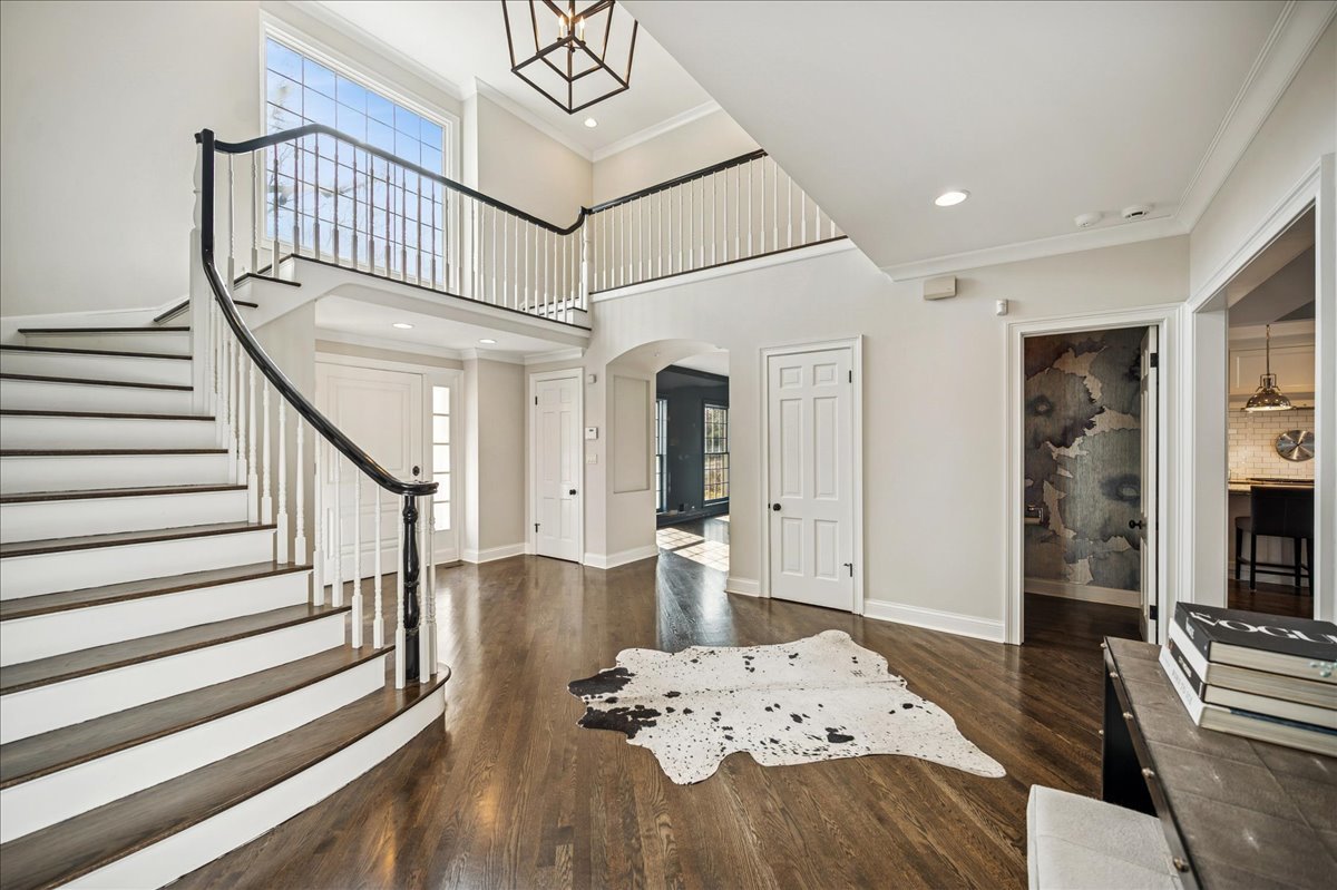 Undisclosed Address Winnetka, IL 60093 - Photo 4 of 55 a view of a livingroom with furniture and staircase