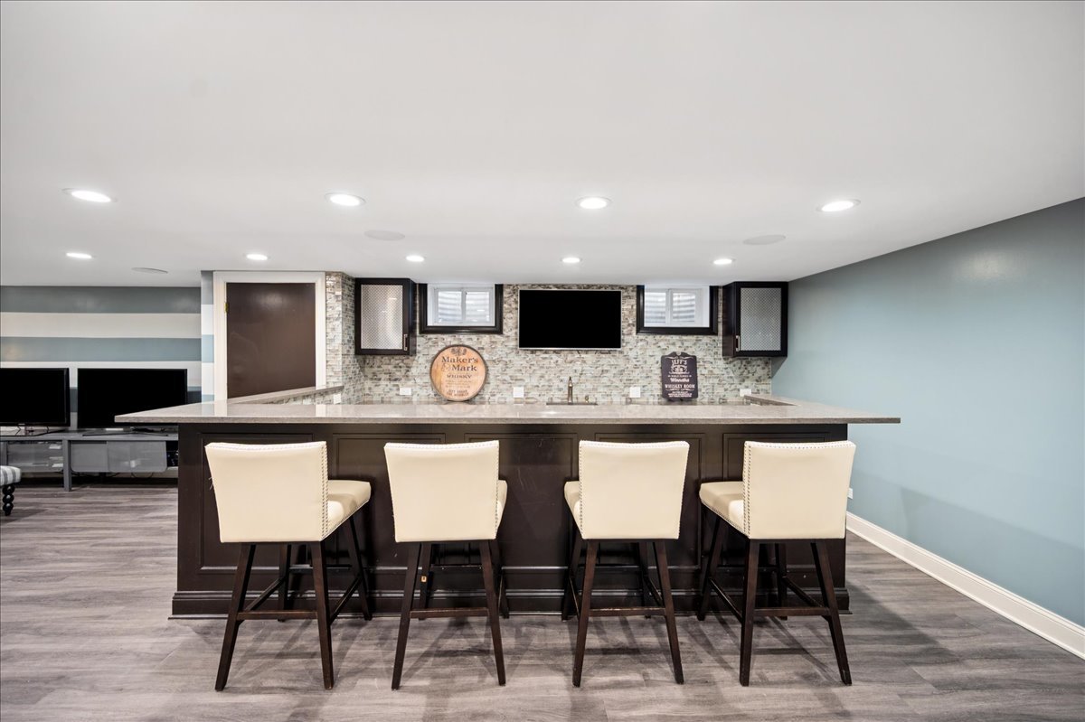 Undisclosed Address Winnetka, IL 60093 - Photo 45 of 55 a kitchen with a table chairs sink and cabinets