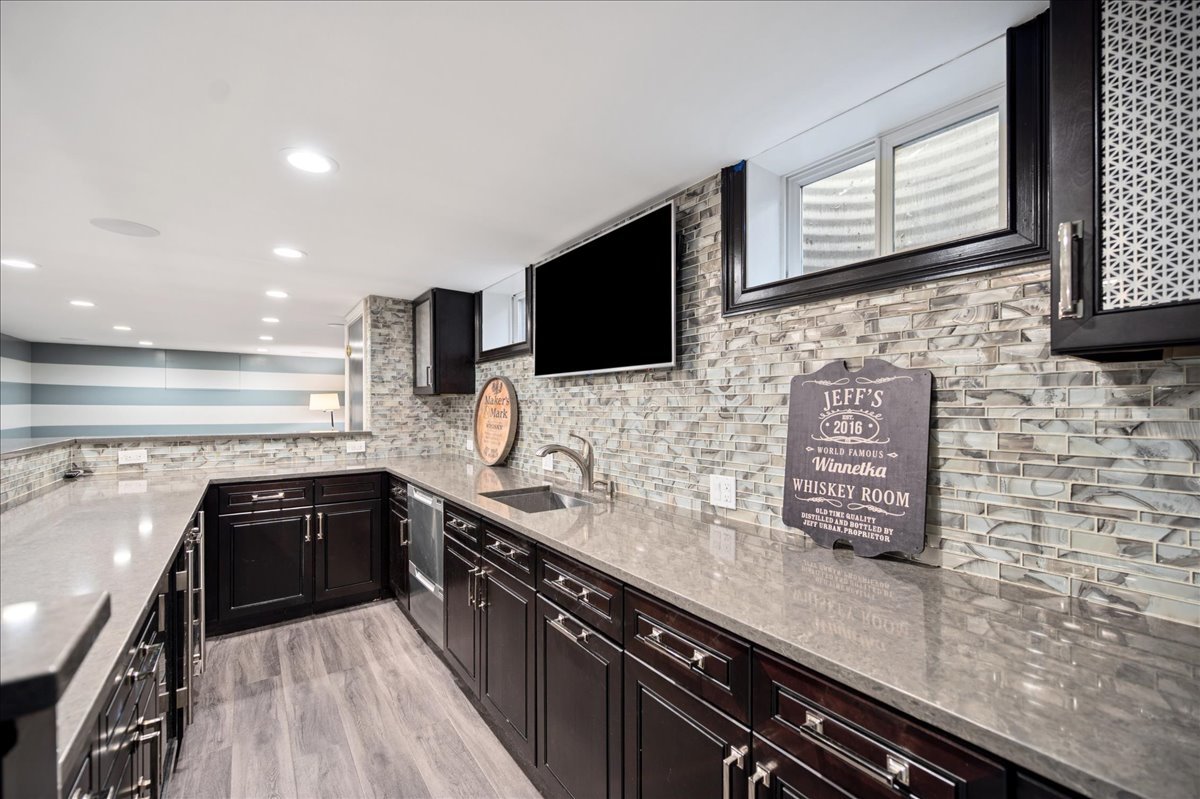 Undisclosed Address Winnetka, IL 60093 - Photo 46 of 55 a kitchen with a sink stove and microwave