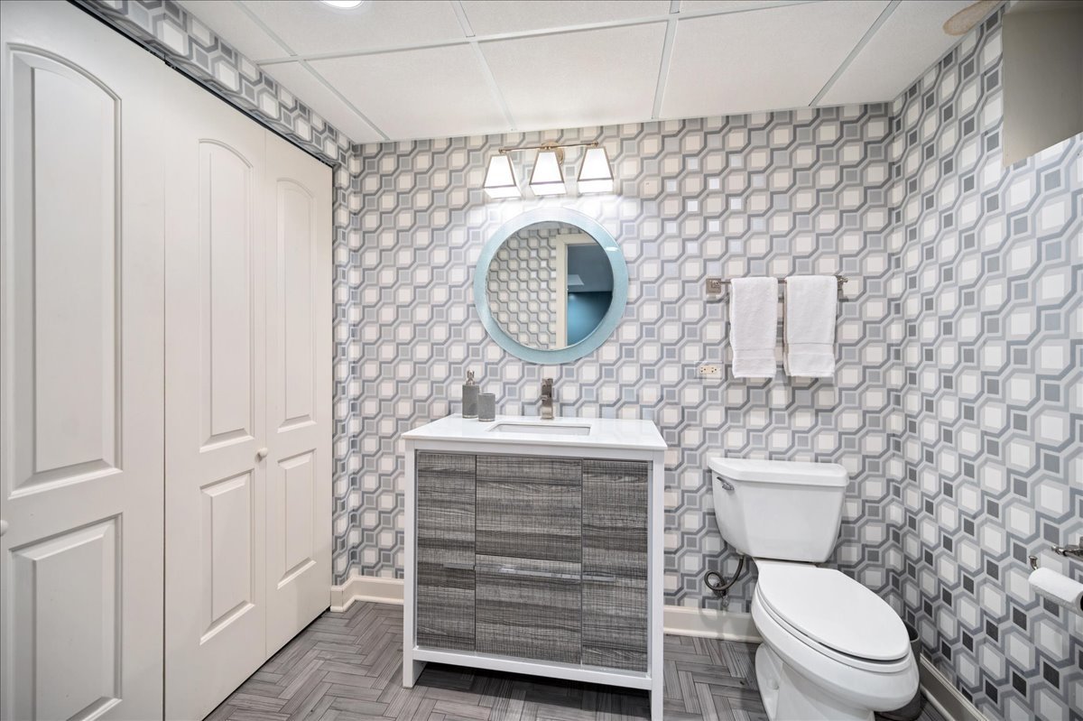 Undisclosed Address Winnetka, IL 60093 - Photo 48 of 55 a bathroom with a toilet a sink and a shower curtain