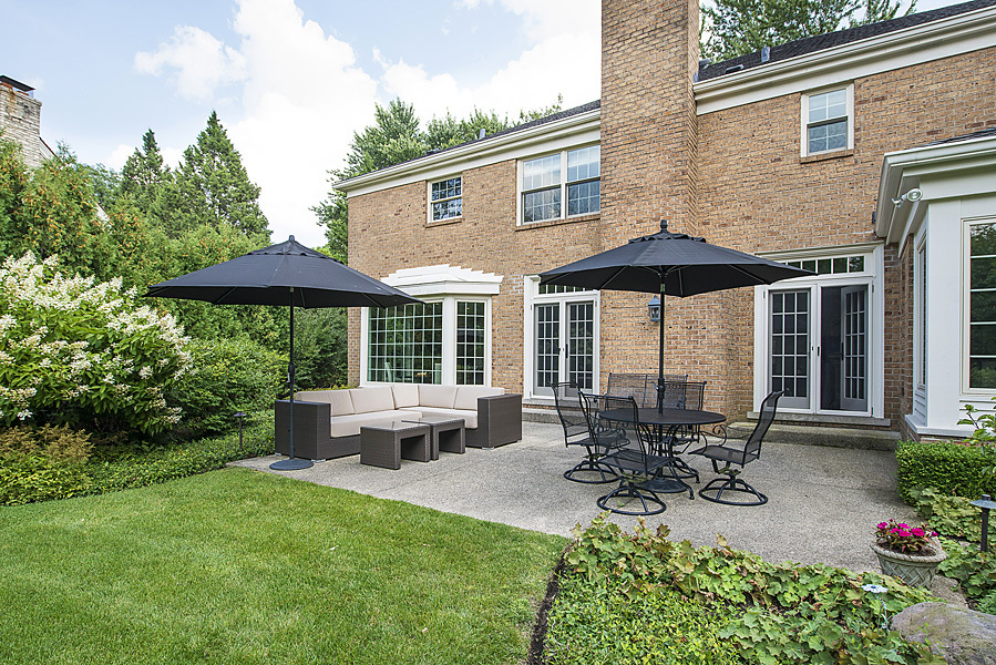 Undisclosed Address Winnetka, IL 60093 - Photo 49 of 55 a view of a house with backyard sitting area and garden