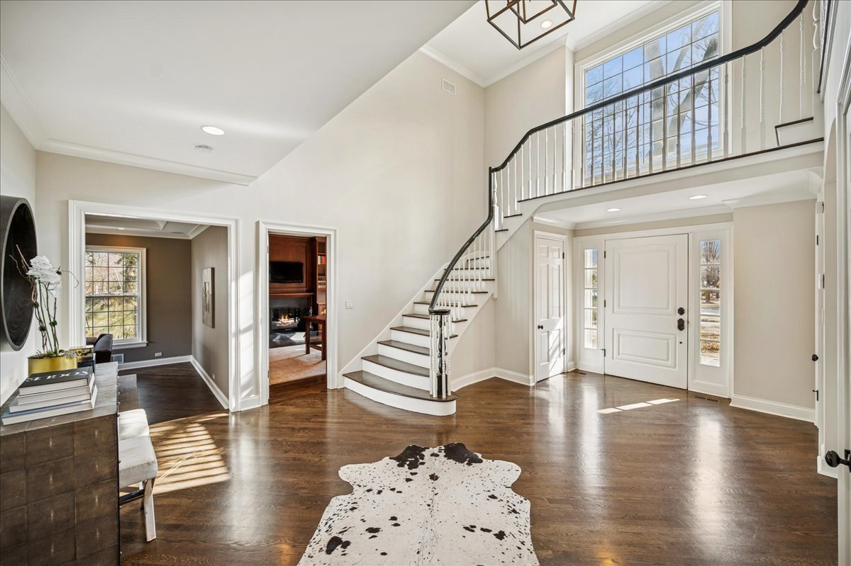 Undisclosed Address Winnetka, IL 60093 - Photo 5 of 55 a view of entryway livingroom and hall with wooden floor