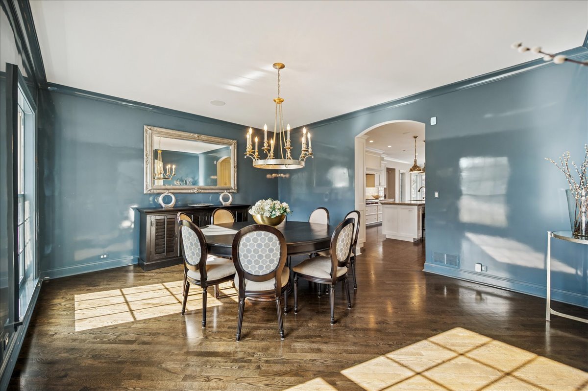 Undisclosed Address Winnetka, IL 60093 - Photo 6 of 55 a view of a dining room with furniture and wooden floor