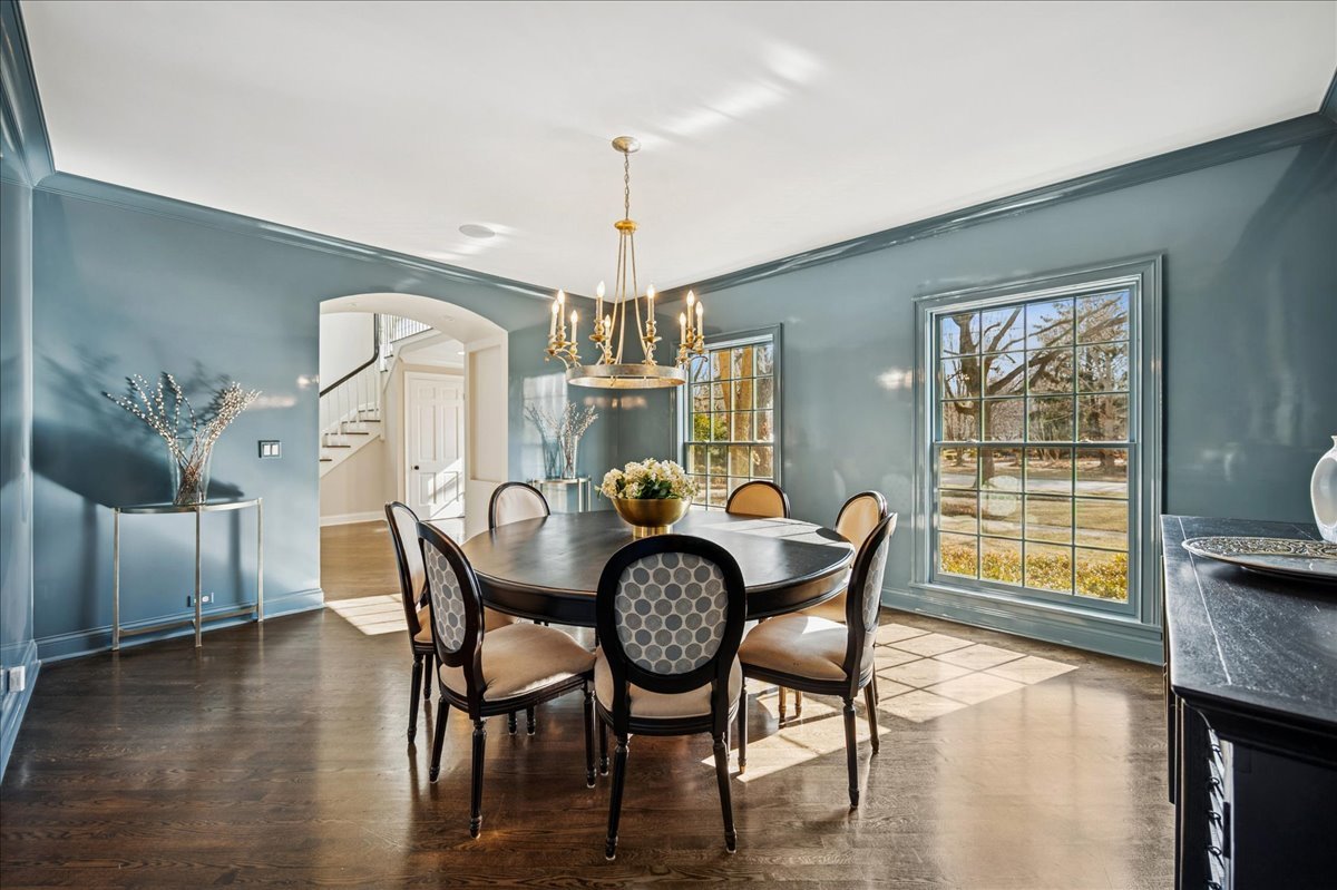Undisclosed Address Winnetka, IL 60093 - Photo 7 of 55 a view of a dining room with furniture window and wooden floor